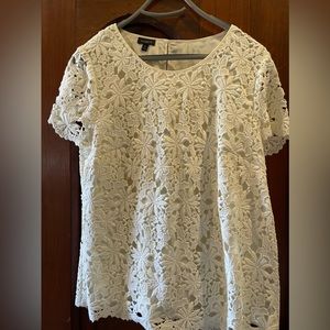 Lace top like new. Worn maybe once.  Does run a little small .  Side zip